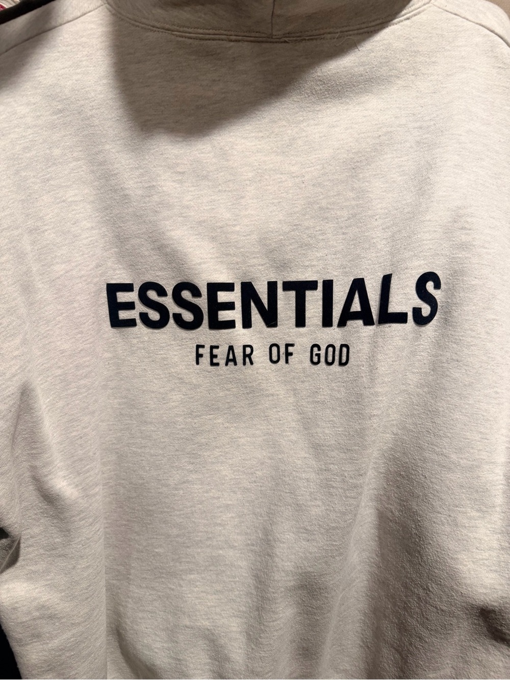 Fear of God ESSENTIALS Hoodie in Light oatmeal Gray with Black Logo